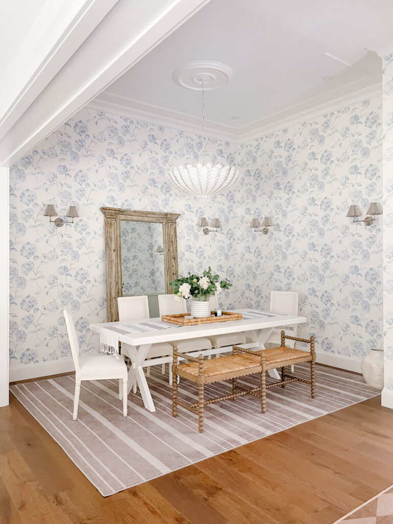 Blue and white Ralph Lauren inspired dining room with striped rug